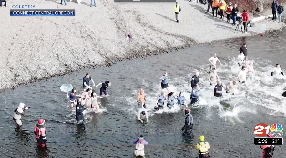 Runners hit the cold water in the February 2020 Bend Special Olympics Polar Plunge