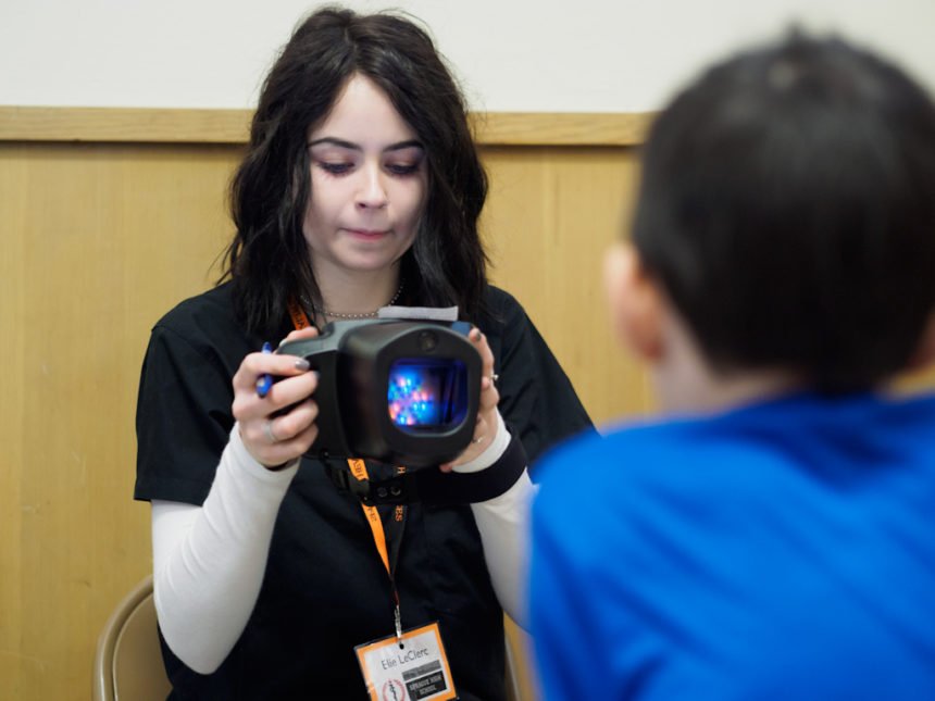 Sprague HS Health Occupations student vision screening