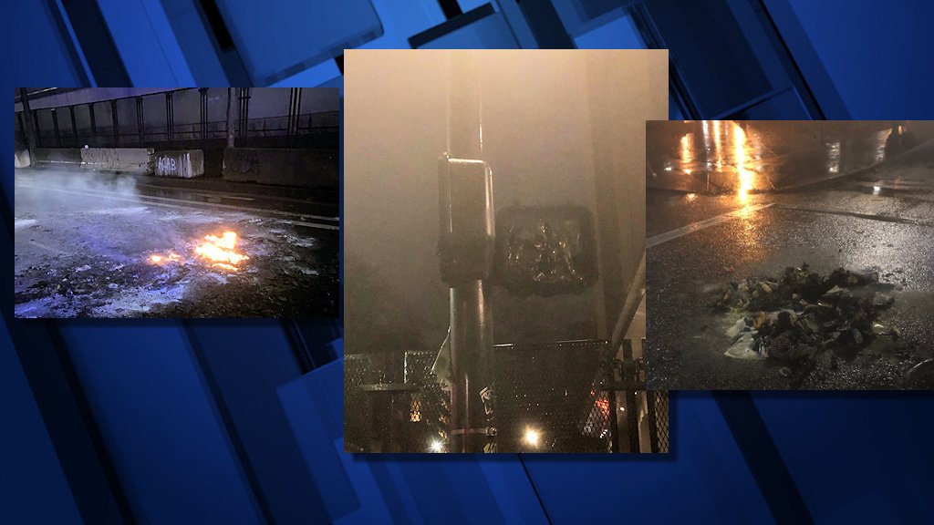 Melted garbaage can, damaged crosswalk signal, fire remnants in New Year's Eve riot in downtown Portland