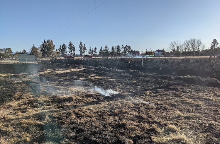 Bend firefighters, assisted by Alfalfa crew, stopped escaped field burn east of Bend late Friday afternoon