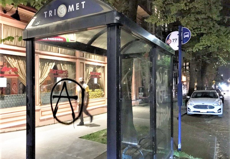 Graffiti on Portland bus stop amid anti-police protest, declared a riot Friday night