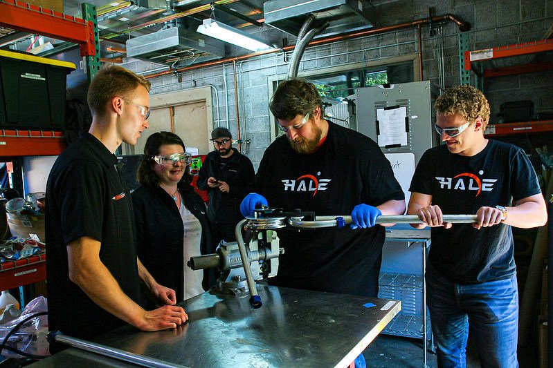 OSU High Altitude Liquid Engine team members bend tubes for a rocket motor test stand. From left are Jacob van de Lindt, Olivia Clark, Devon Burson, Adam Ragle and Colton Harms
