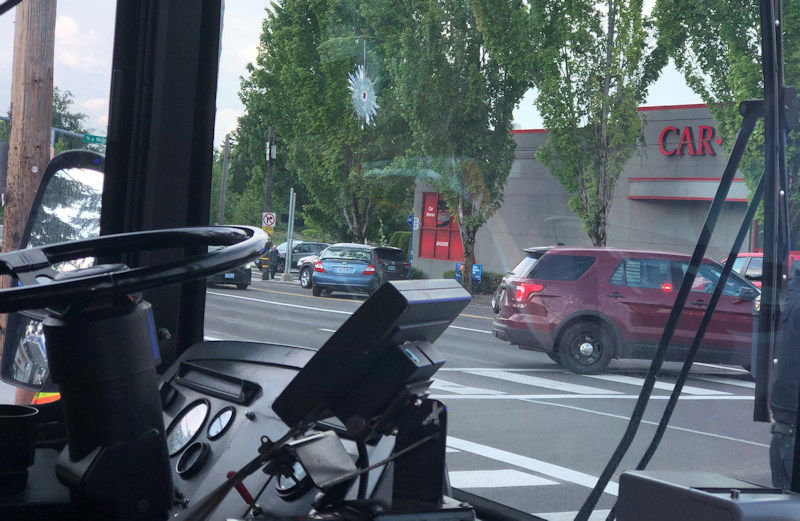 Bullet hole can be seen in window of Portland TriMet bus