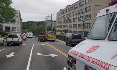Emergency vehicles surround an apartment building in Willimantic