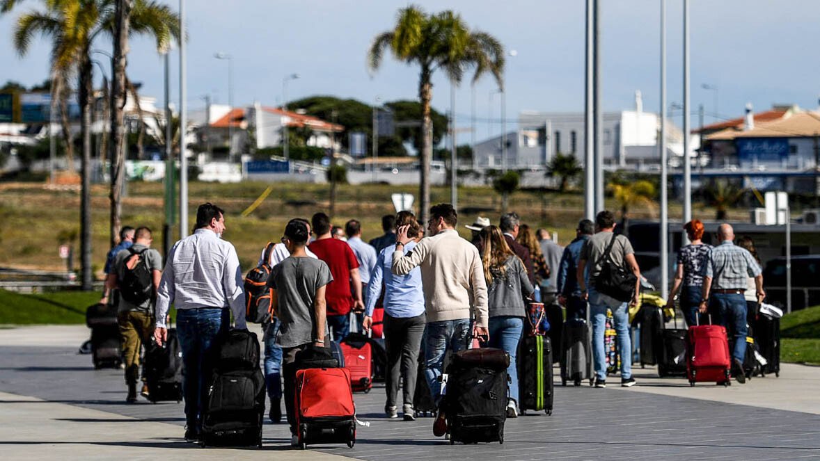 <i>PATRICIA DE MELO MOREIRA/AFP via Getty Images</i><br/>Travelers from the UK arrive in Portugal on the first day of post-restriction travel.