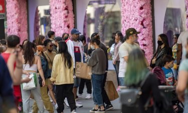 People congregate in front of the decorations during the Macy's Flower Show at Macy's Herald Square amid the coronavirus pandemic on May 2.