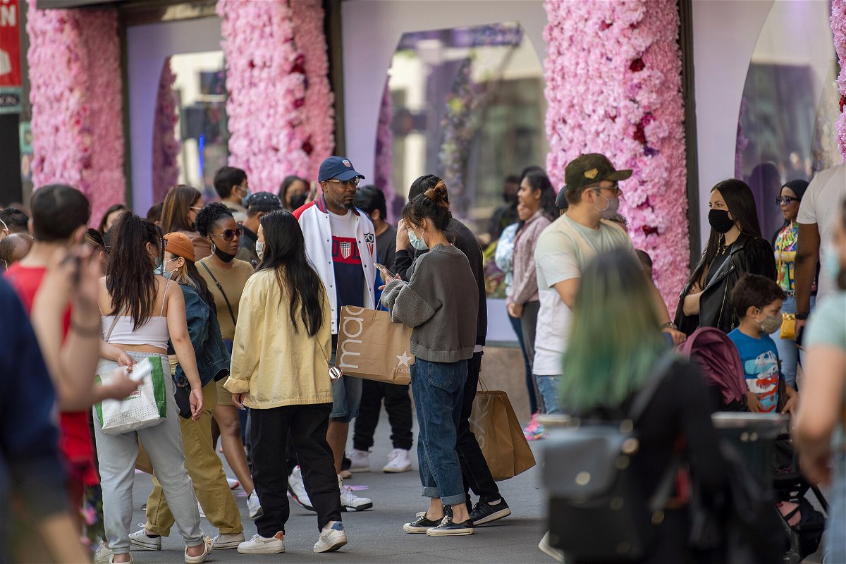 <i>Alexi Rosenfeld/Getty Images</i><br/>People congregate in front of the decorations during the Macy's Flower Show at Macy's Herald Square amid the coronavirus pandemic on May 2.