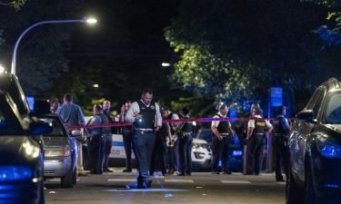 Chicago police respond to the scene of a shooting Sunday