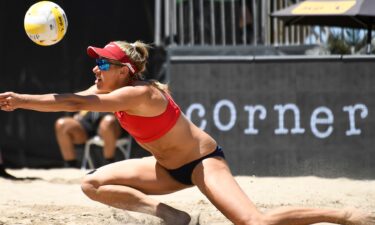 April Ross spikes a volleyball