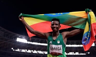 Ethiopia's Selemon Barega celebrates after winning the men's 10000m final during the Tokyo 2020 Olympic Games