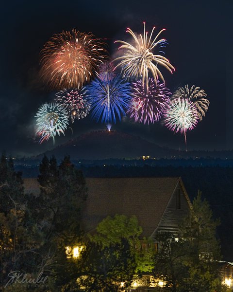 A composite of fireworks shots from Bend's Pilot Butte, as seen from Powell Butte