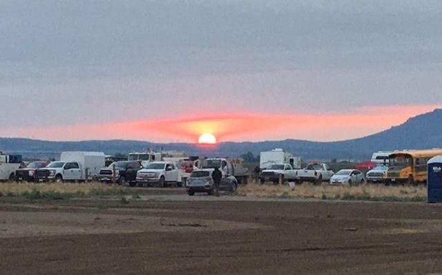 Sun rises over the horizon at the XZ spike camp on the Bootleg Fire