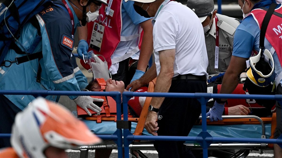 USA's Connor Fields receives medical assistance after the cycling BMX racing men's semi-finals run at the Ariake Urban Sports Park during the Tokyo 2020 Olympic Games