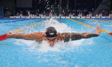 Caeleb Dressel races the final of the men's 100m butterfly on Day 8 at the Tokyo Olympics.
