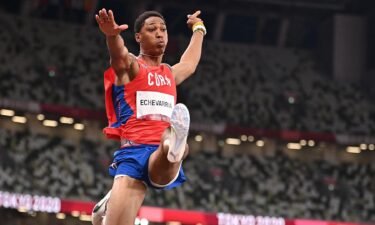 Cuba's Juan Miguel Echevarria competes in the men's long jump qualification during the Tokyo 2020 Olympic Games