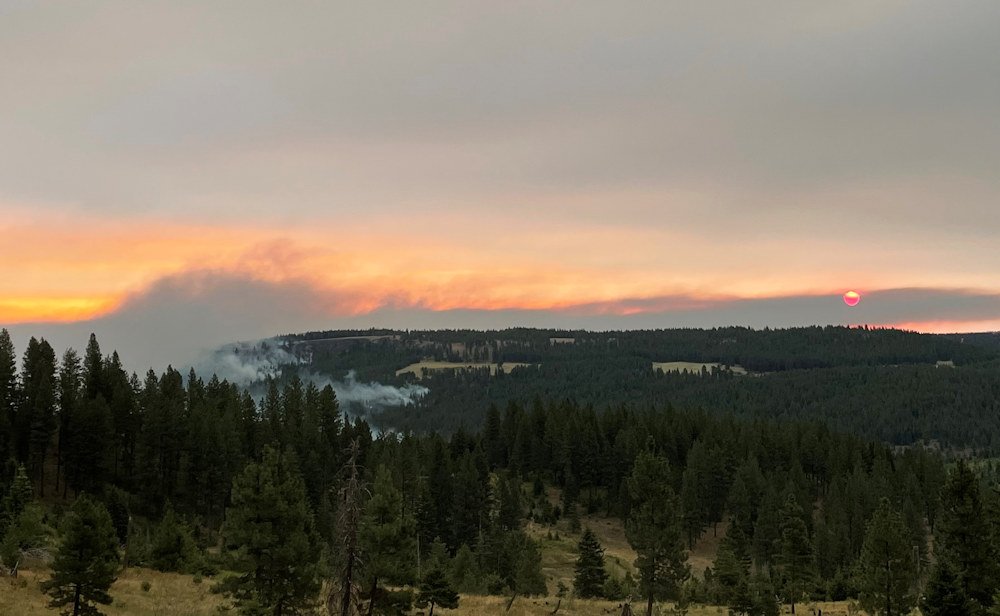 Smoke hovers from the Elbow Creek Fire in NE Oregon