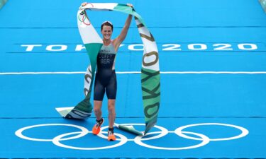 Flora Duffy of Team Bermuda celebrates winning the gold medal during the Women's Individual Triathlon