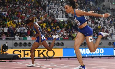 First-placed USA's Dalilah Muhammad (L) and second-placed USA's Sydney Mclaughlin (R) cross the finish line in the Women's 400m Hurdles final at the 2019 IAAF Athletics World Championships