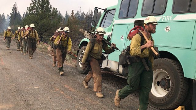 Hand crew walks to engage the massive Bootleg Fire in southern Oregon