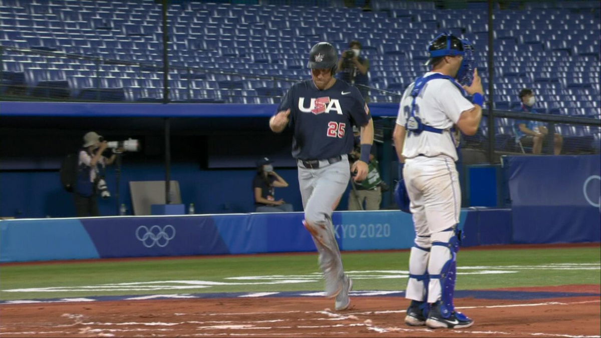 Member of the U.S. Olympic baseball team touches home plate