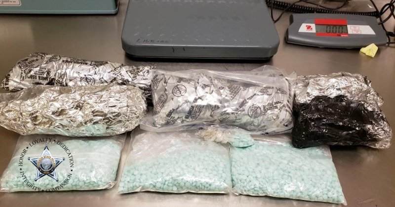 Oregon State Police say over 4 pounds of methamphetamine, pound of suspected fentanyl pills were found hidden in car