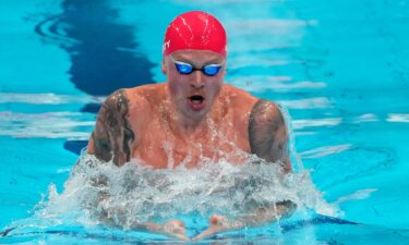 Adam Peaty competes in the 100m breaststroke