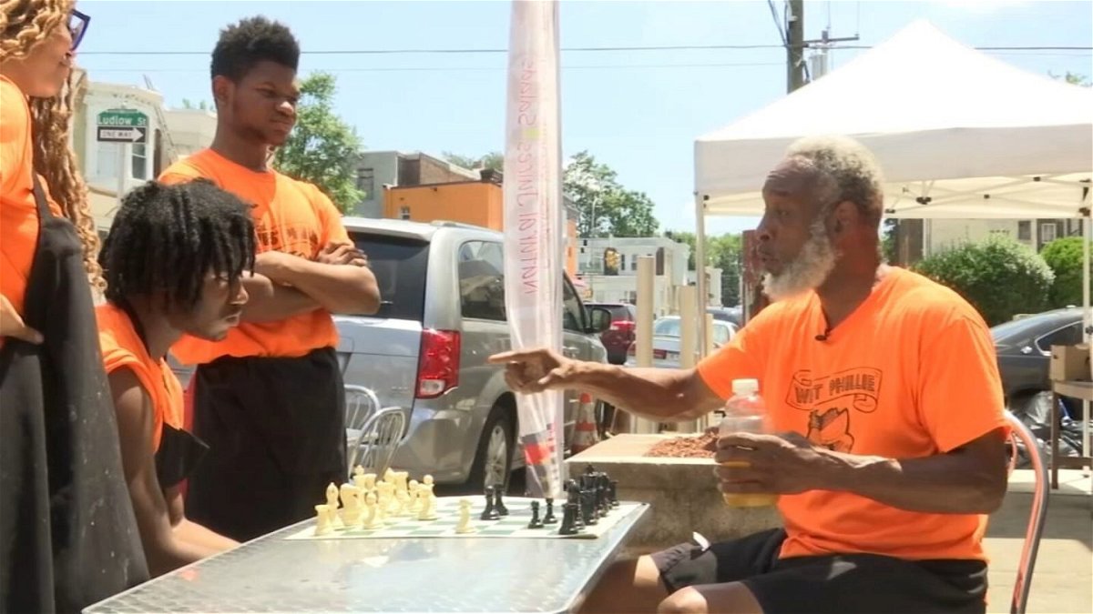 <i>WPVI</i><br/>Arnett Woodall (seated) mentors youth and provides guidance and support from his food stand in Philadelphia.