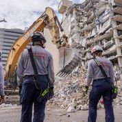 Task forces from throughout Florida work to remove debris in order to find survivors from the Champlain Towers building collaps