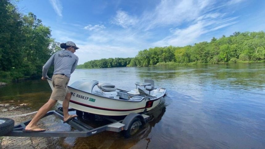 <i>Wisconsin State Journal</i><br/>Gabe Stelzer launches his drift boat last week on the Michigan side of the Menominee River just below the Upper Peninsula's Grand Rapids power dam.