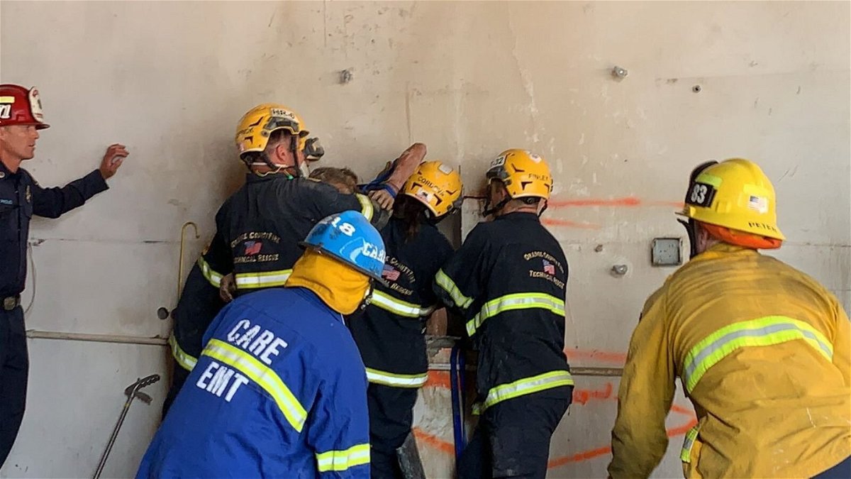<i>Orange County Fire Authority</i><br/>Crews rescued a woman who became trapped between two buildings in Santa Ana Tuesday afternoon.