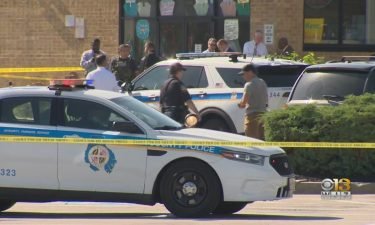 Two officers were injured and a suspect later died in a shootout at Security Square Mall in Woodlawn