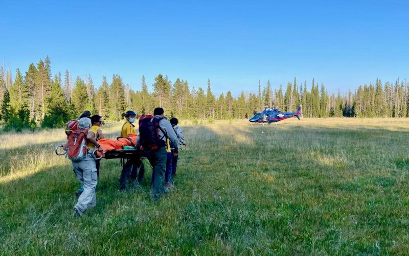 Deschutes County Sheriff's Search and Rescue volunteers bring injured mtn. biker to waiting Life Flight helicopter Thursday evening