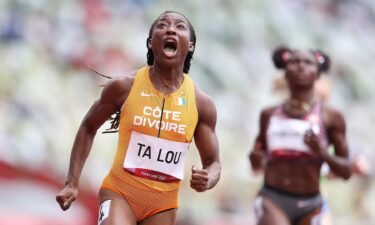 Marie-Josee Ta Lou of Team Ivory Coast reacts while competing during round one of the Women's 100m heats