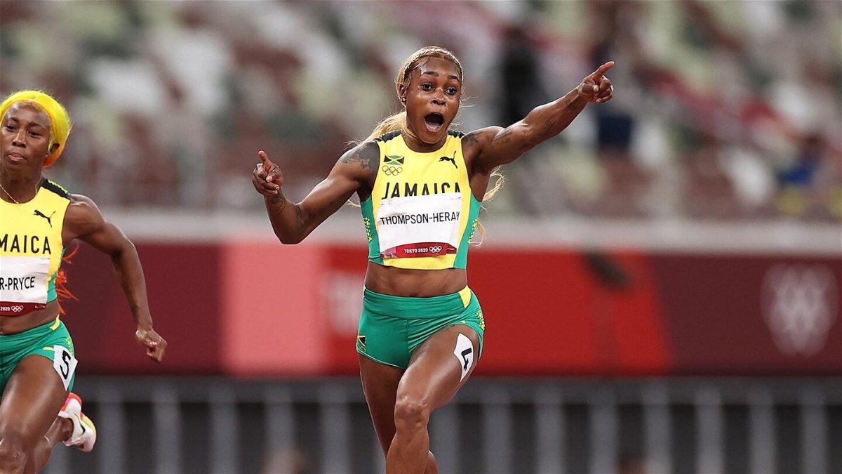 Elaine Thompson-Herah of Team Jamaica celebrates after winning the gold medal in the Women's 100m Final on day eight of the Tokyo 2020 Olympic Games