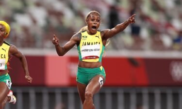 Elaine Thompson-Herah of Team Jamaica celebrates after winning the gold medal in the Women's 100m Final on day eight of the Tokyo 2020 Olympic Games