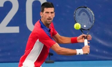 Novak Djokovic competes in Tokyo