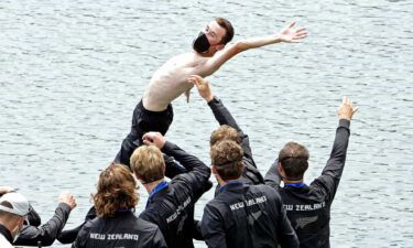 New Zealand celebrates winning the gold medal in the men's eight Friday at the Tokyo Olympics.