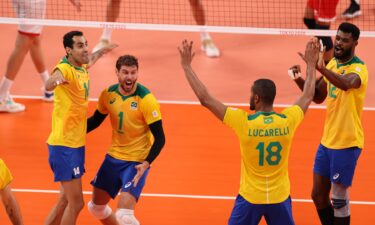 Team Brazil celebrates against Team Tunisia during pool play