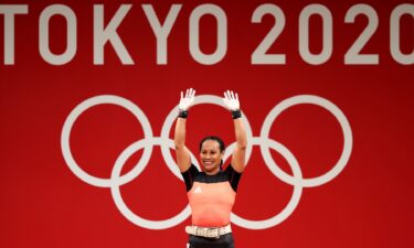 Dika Toua smiles after making history as first five-time female Olympian lifter