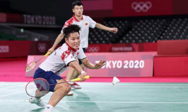 Wang Yilyu and Huang Dongping play in the badminton mixed doubles gold medal match against Zheng Siwei and Huang Yaqiong in Tokyo