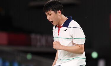 Heo Kwang-Hee of Team South Korea reacts as he competes against Kento Momota of Team Japan during a Men’s Singles Group A match on day five of the Tokyo Olympics