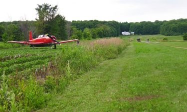 A woman mowing the grass at a small airfield in Quebec died after she was hit by a plane as it came in for a landing.