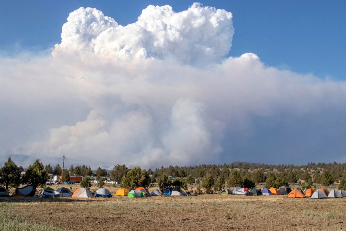 <i>Payton Bruni/AFP/Getty Images</i><br/>A pyrocumulus cloud caused by the Bootleg Fire drifts north of a firefighter operating base in Bly