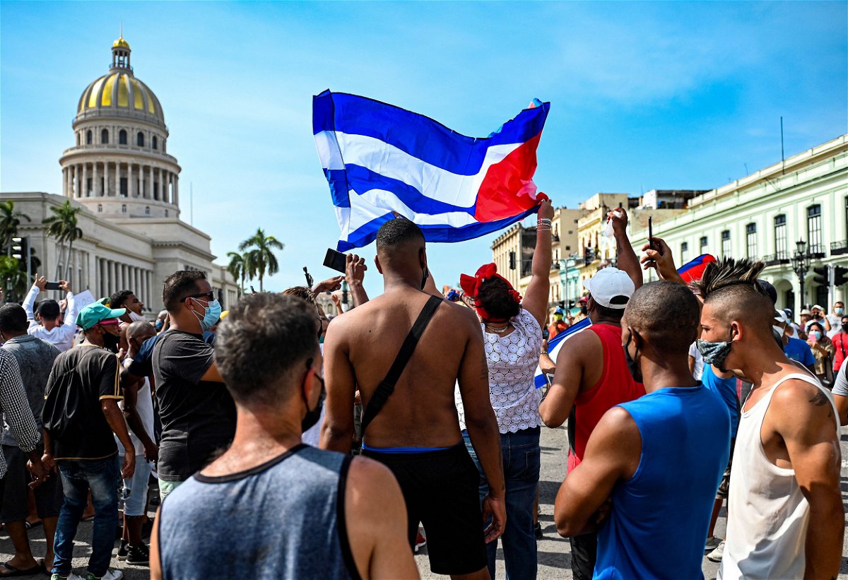 <i>Yamil Lage/AFP/Getty Images</i><br/>Cubans gather outside the Capitol to demonstrate against the government of President Miguel Diaz-Canel on July 11.