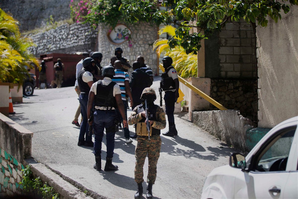 <i>Joseph Odelyn/AP/FILE</i><br/>Security forces at the Haitian presidential residence in Port-au-Prince on July 7