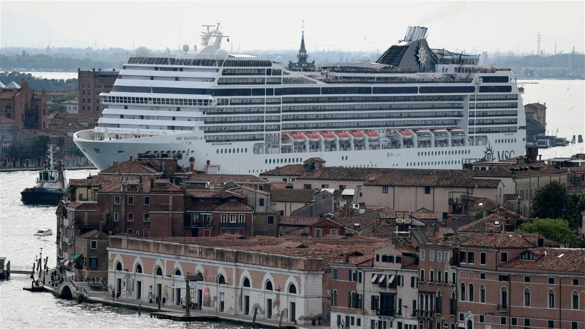 <i>Miguel Medina/AFP via Getty Images</i><br/>Cruise ships sailing through the city center have been a controversial sight. First there was a ban