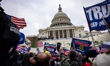 Pro-Trump supporters storm the U.S. Capitol following a rally with President Donald Trump on January 6. A third member of the far-right Oath Keepers group will plead guilty on July 20 and cooperate with prosecutors