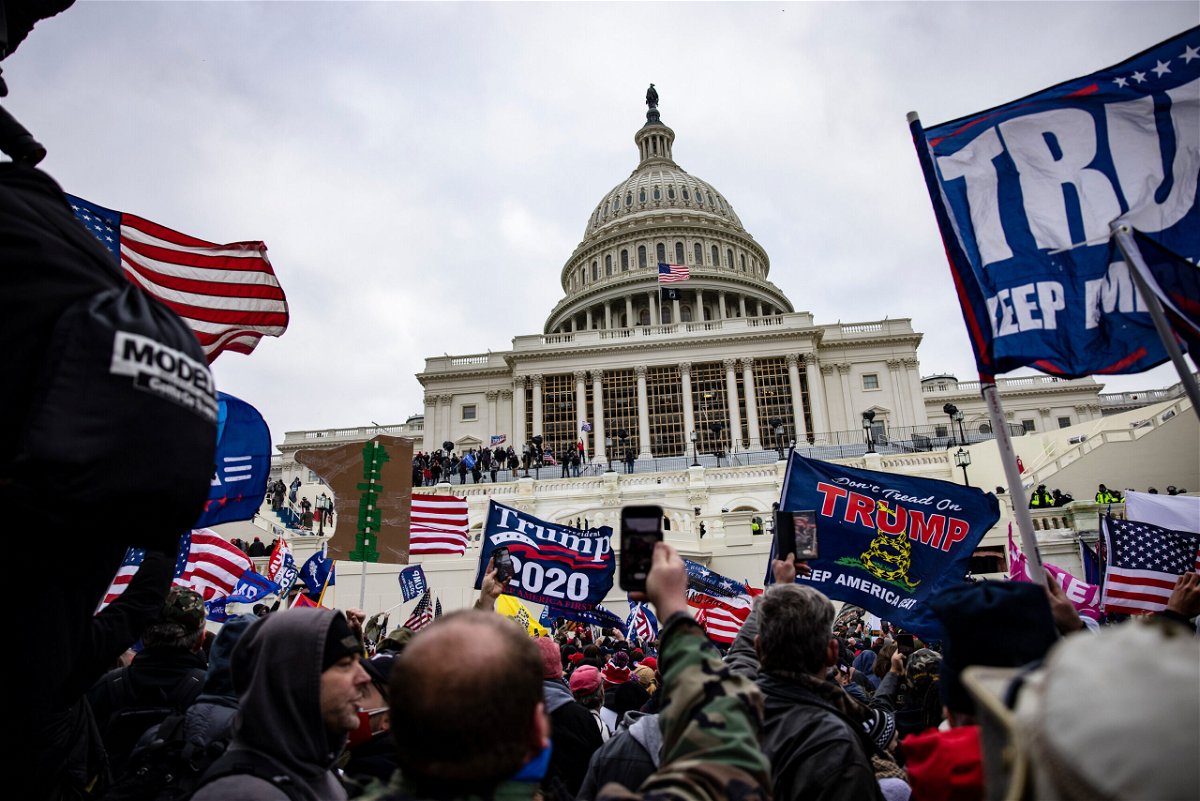 <i>Samuel Corum/Getty Images</i><br/>Pro-Trump supporters storm the U.S. Capitol following a rally with President Donald Trump on January 6. A third member of the far-right Oath Keepers group will plead guilty on July 20 and cooperate with prosecutors