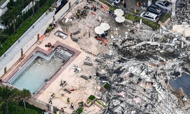 Aerial view shows search and rescue personnel working on site after the partial collapse of the Champlain Towers South in Surfside