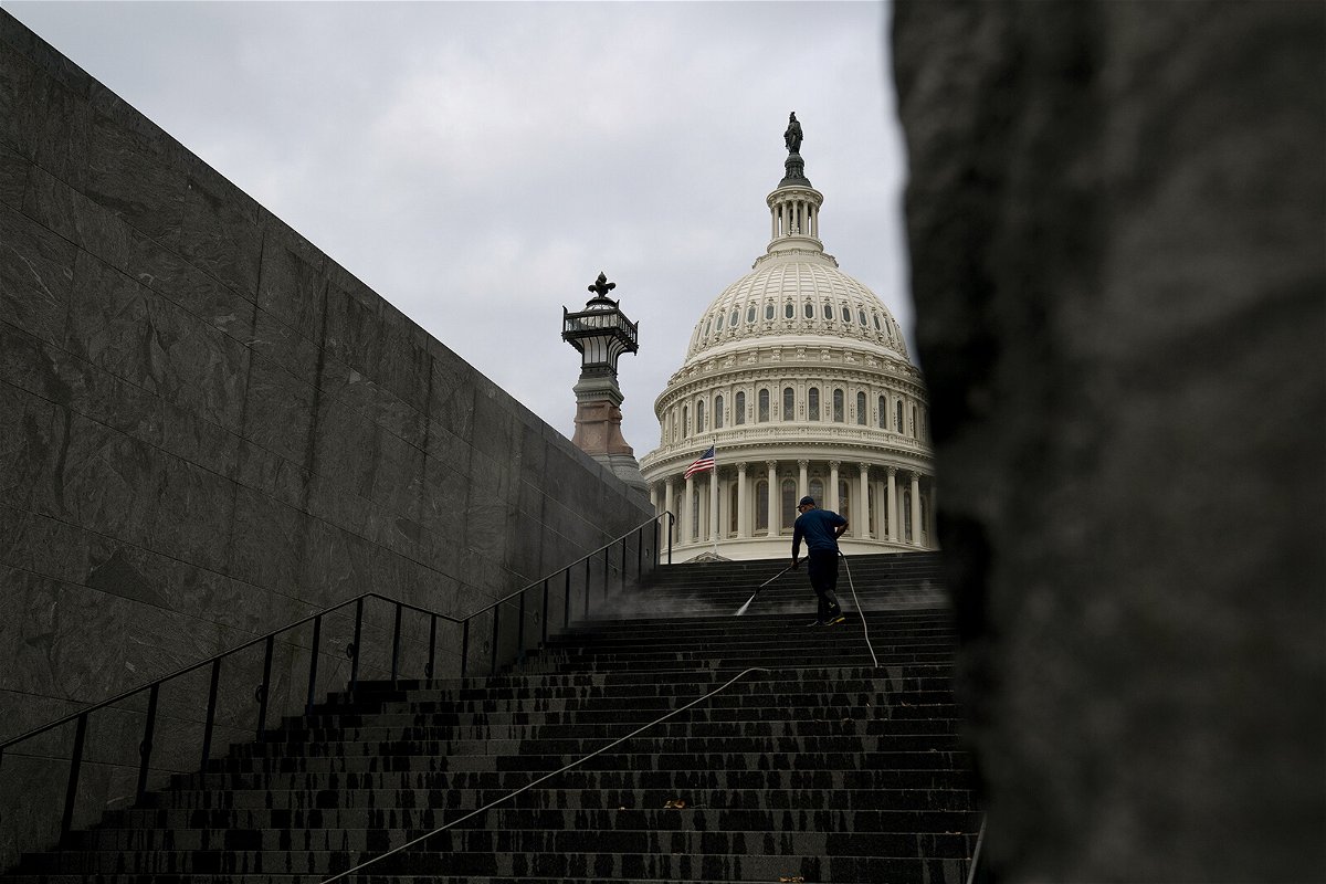 <i>Stefani Reynolds/Bloomberg/Getty Images</i><br/>A worker cleans the steps near the U.S. Capitol in Washington
